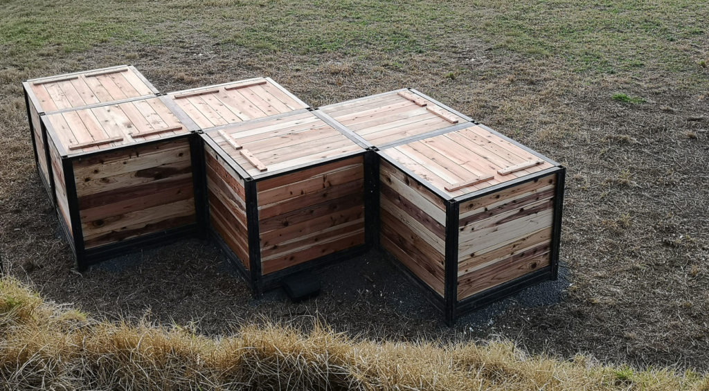 6 compost bins placed outiside in staggered formation to show where to place CarbonCycle Composters